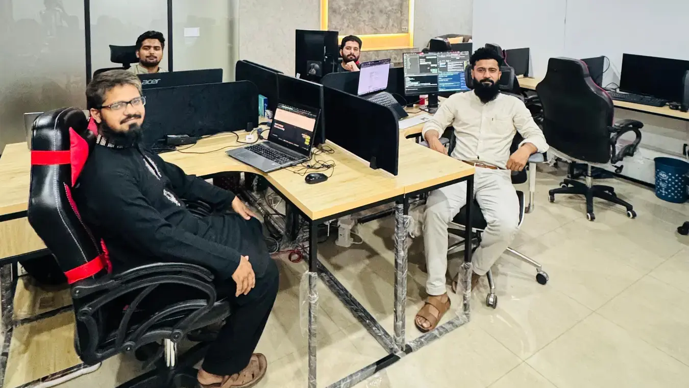 Members of the Lahore product team working together in the office